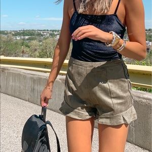 Suede green shorts with lace up detail